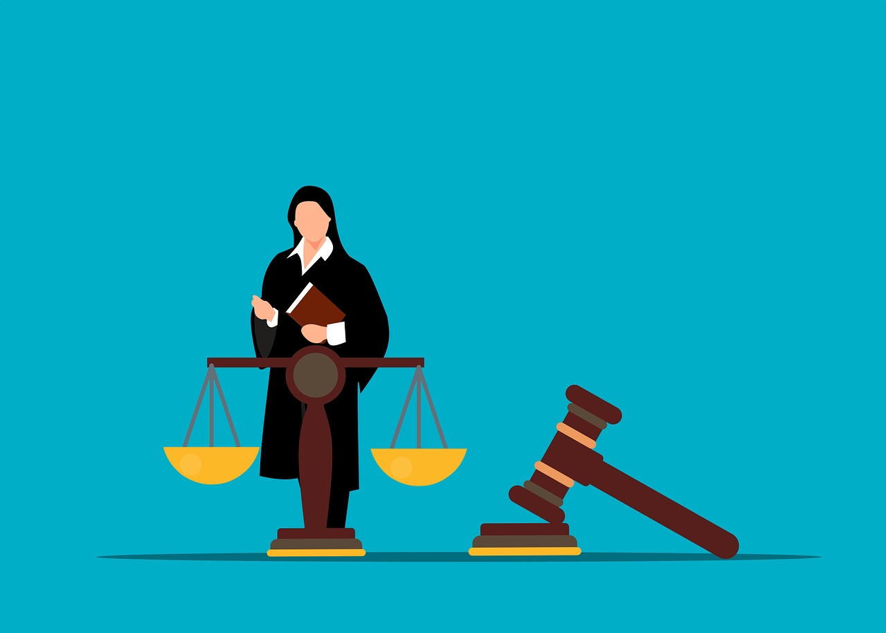 dessin représentant une avocate devant les symboles de la justice
